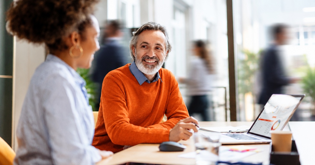 Agentic Agency Blog Billboard - coworkers talking at desk