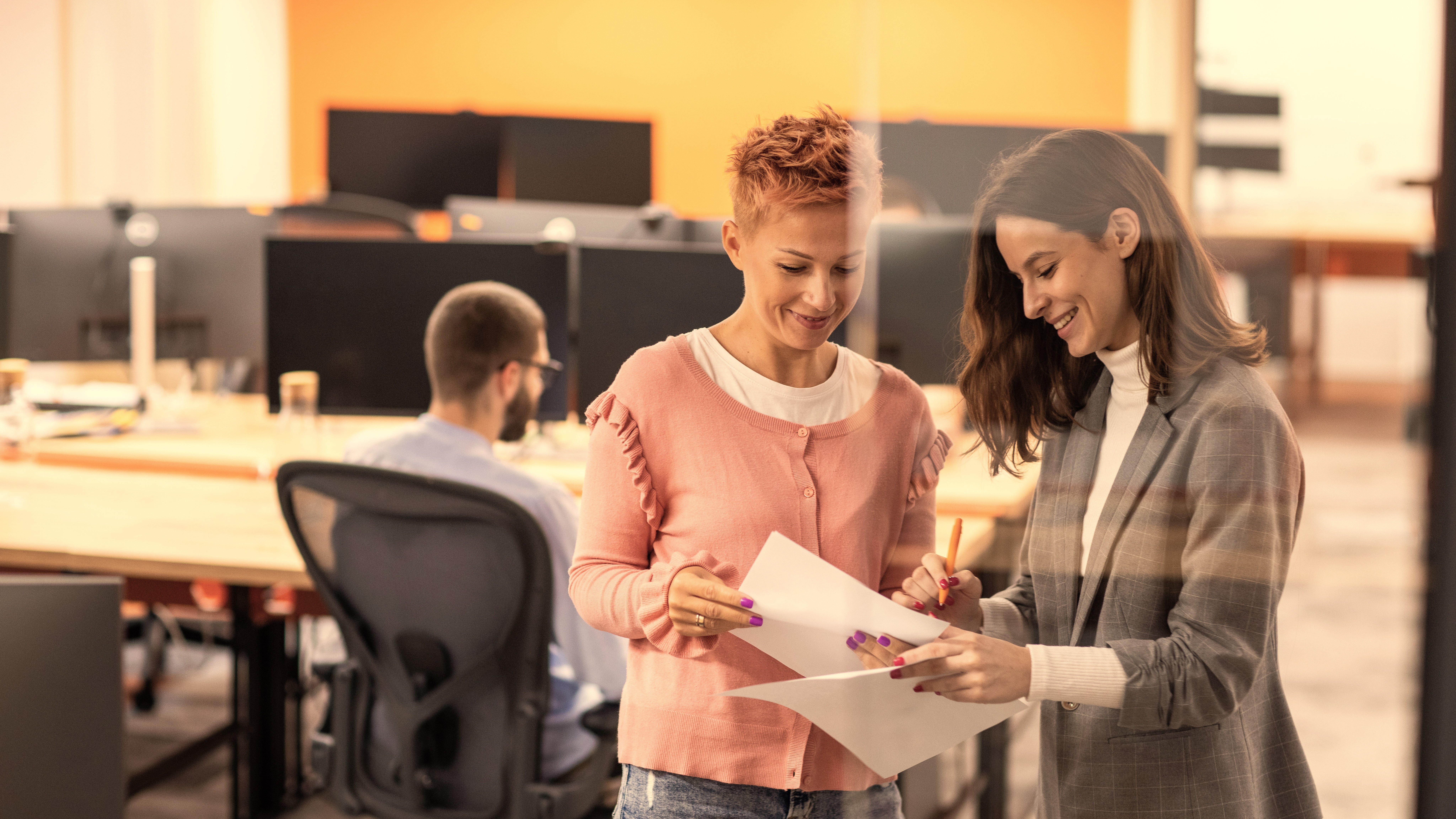 Insurance carrier employees reviewing paperwork