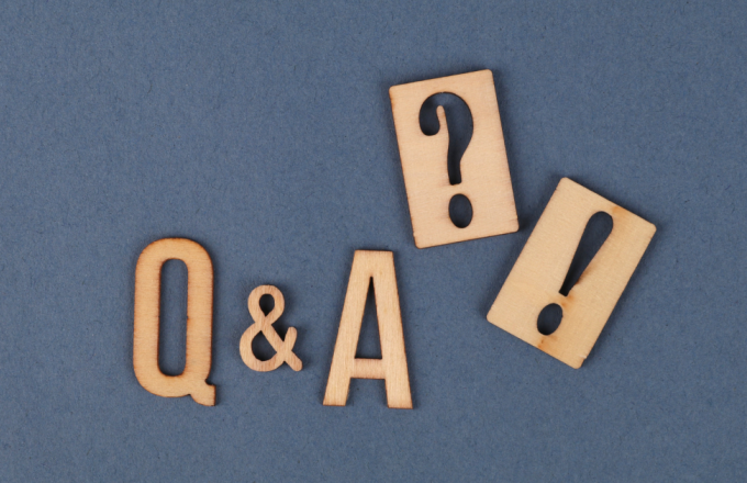 Carved Q and A blocks on a blue background