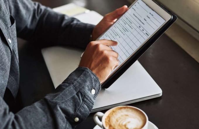 Insurance agent on tablet getting assistance