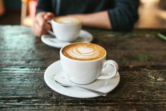 cup of coffee with pretty steamed milk design