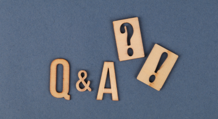 Carved Q and A blocks on a blue background