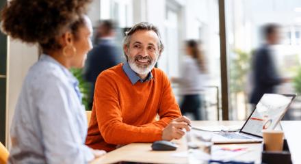 Agentic Agency Blog Billboard - coworkers talking at desk