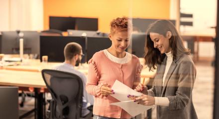 Insurance carrier employees reviewing paperwork
