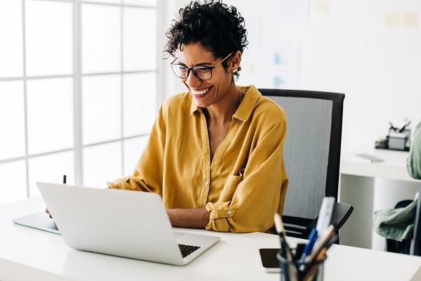 Happy woman working at desk