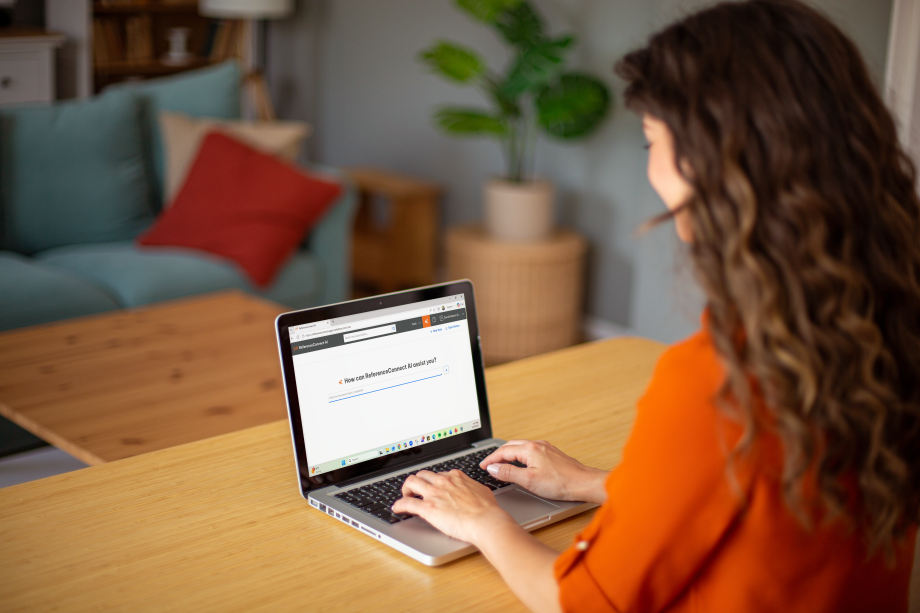 ReferenceConnect AI Carrier working on laptop