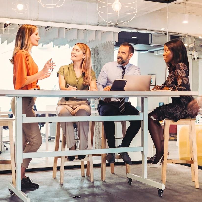 AI in insurance - coworkers at table