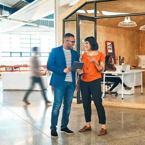 Choose your AMS - Velocity AI - coworkers talking in office