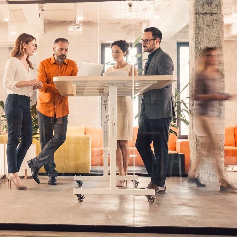 How AI Velocity works - group standing at table